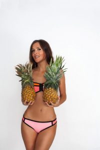 Sydney Topless Waitresses Anastasia in pink bikini holding pineapples